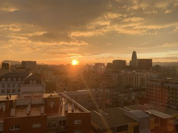 High angle view of buildings against sky during sunset