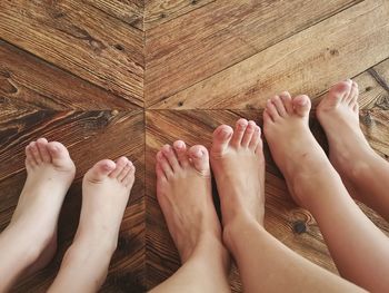 Low section of people feet on floor