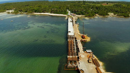 Bridge under construction over the sea bay connecting the two parts of siargao island.