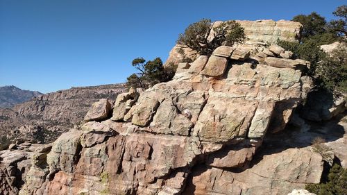 Low angle view of rock formation against blue sky