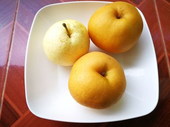 High angle view of apples in bowl on table