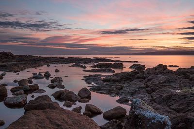 Scenic view of sea against sky at sunset