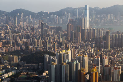 Aerial view of modern buildings in city against sky