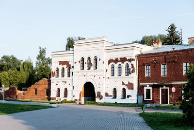 Facade of historic building against clear sky