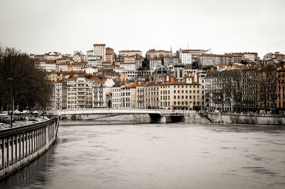 Pont marechal juin over saone river against buildings