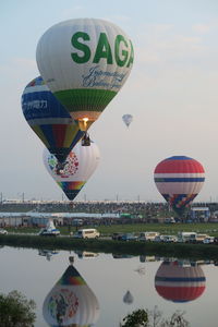 Multi colored hot air balloon flying in sky