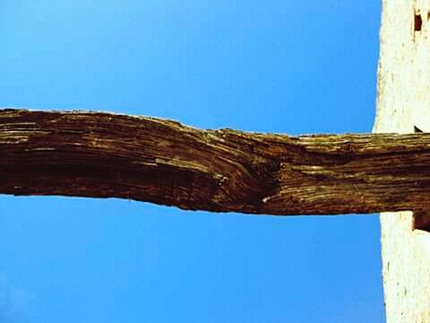 LOW ANGLE VIEW OF BUILT STRUCTURES AGAINST BLUE SKY