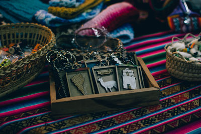 High angle view of keychains in wooden container at store