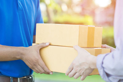 Close-up of hand holding paper