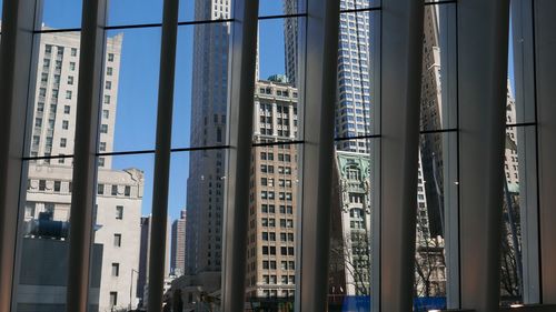 Low angle view of modern buildings against clear sky