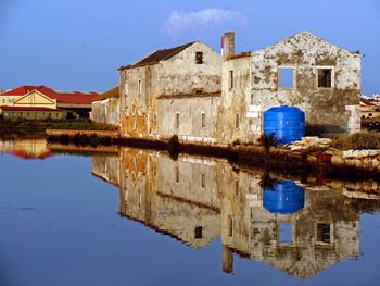 Buildings against blue sky and clouds
