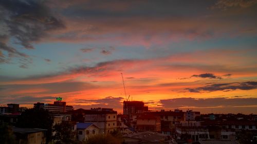 Cityscape against sky during sunset