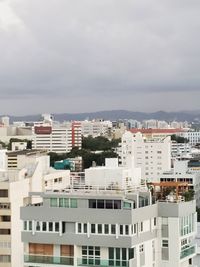 Buildings in city against sky