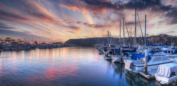 Pink sunset over boats at the harbor of dana point, california