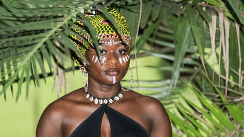 African woman in the jungle with natural evening sun in the tropical part of aburi ghana west africa