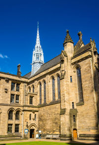 Low angle view of building against blue sky