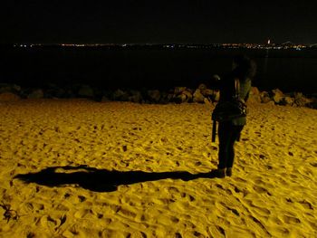 Full length of woman standing at night