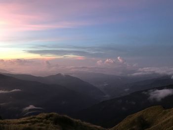 Scenic view of mountains against sky during sunset