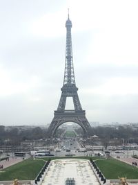 Tower in city against sky