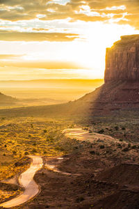 Scenic view of beach against sky during sunset