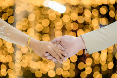 Cropped hand of woman holding hands