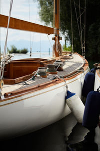 Sailboats moored in sea