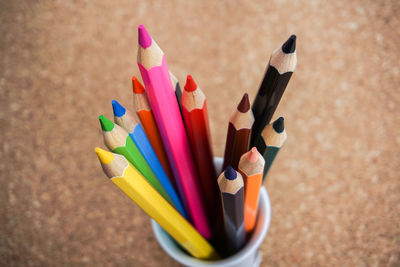 Close-up of multi colored pencils on table