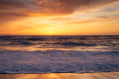 Scenic view of sea against sky during sunset