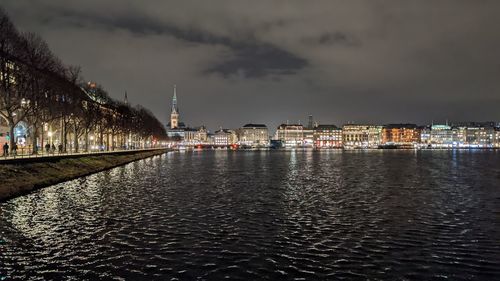 Illuminated city at waterfront