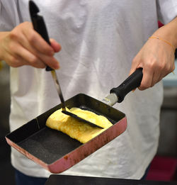 Midsection of man preparing food