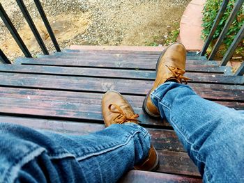 Low section of man sitting on bench