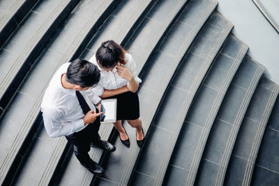 High angle view of people walking in office