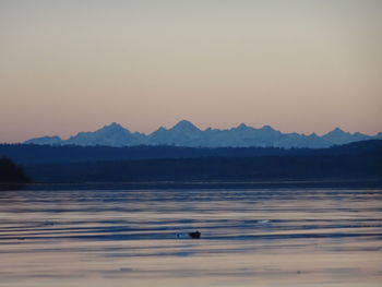 Scenic view of beach against sky during sunset