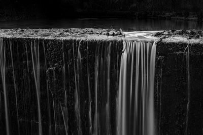 Close-up of water flowing on wood