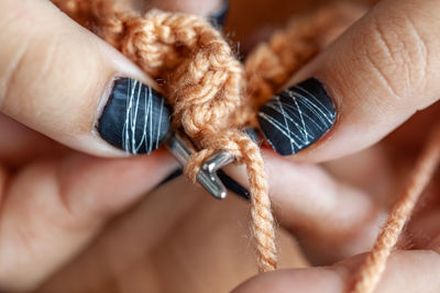 Close-up of human hand holding ring