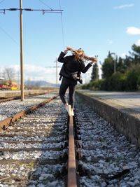 Man standing on railroad track