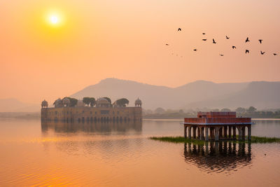 Tranquil morning at jal mahal water palace at sunrise in jaipur. rajasthan, india