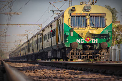 Train on railroad track against sky