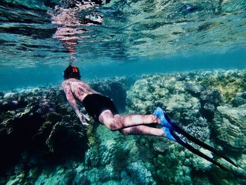 Man swimming in sea