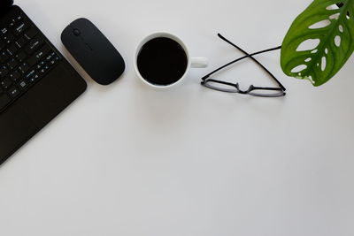 Directly above shot of coffee cup on table