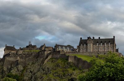 Low angle view of historical building against cloudy sky