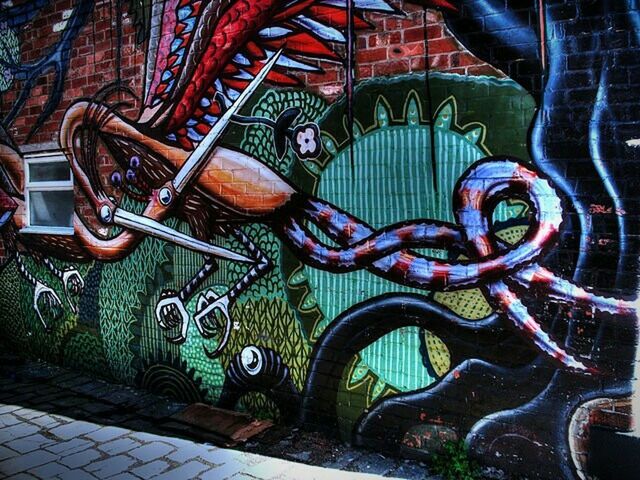 graffiti, built structure, pattern, multi colored, architecture, building exterior, outdoors, wall - building feature, design, day, art, art and craft, no people, creativity, street, metal, protection, street art, cobblestone, transportation