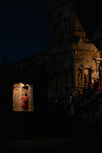 Low angle view of statue against sky at night