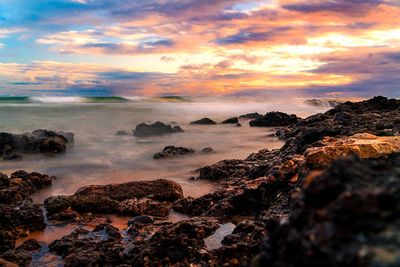 Scenic view of sea against sky at sunset