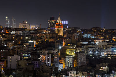 Illuminated galata tower in city at night