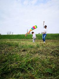 Couple standing on field