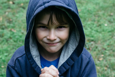 Close-up portrait of smiling boy at park