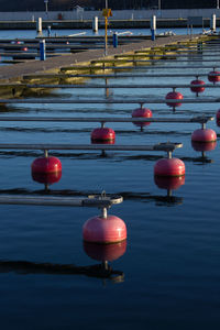 High angle view of illuminated red lights in sea