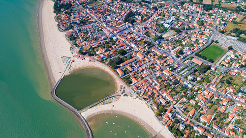 High angle view of cityscape seen through airplane window