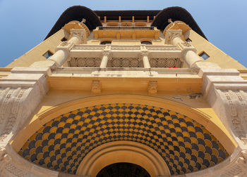 Low angle view of ornate building against sky